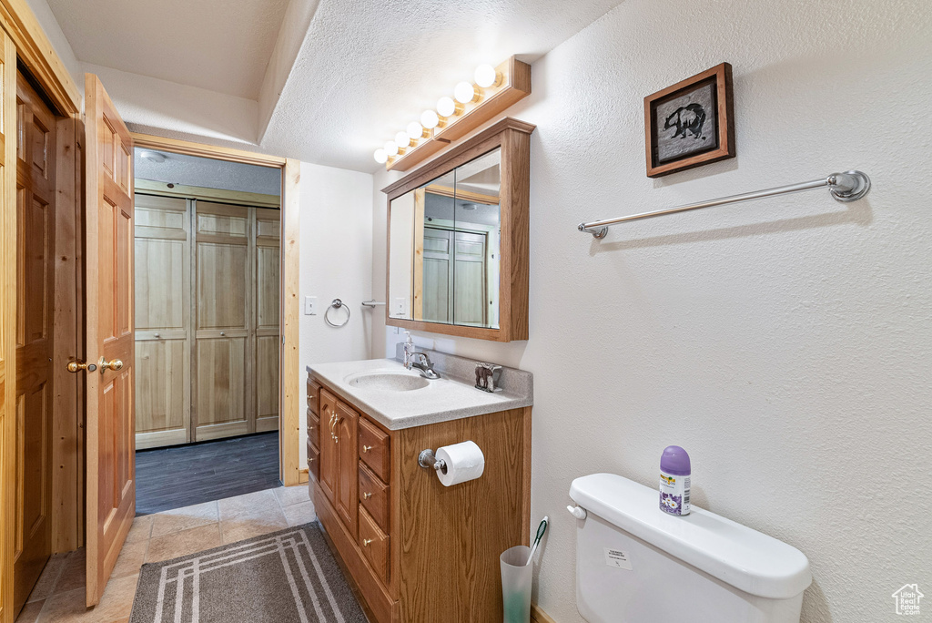 Bathroom with vanity and tile patterned floors