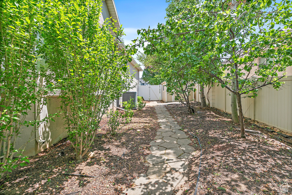 Fenced backyard featuring a gate