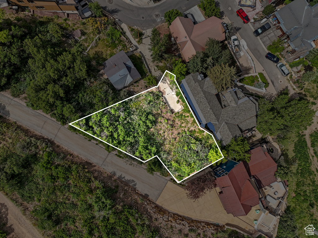 Aerial view of residential area featuring property boundaries highlighted