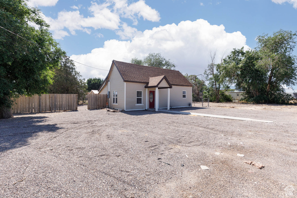View of front of property featuring roof with shingles