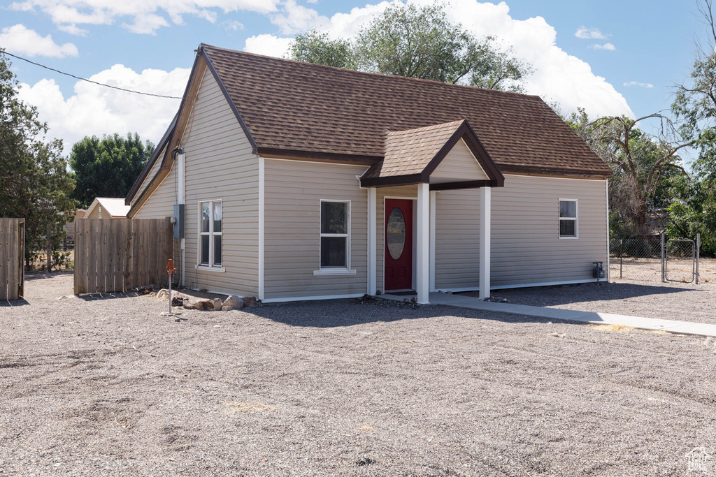 View of front of property with roof with shingles