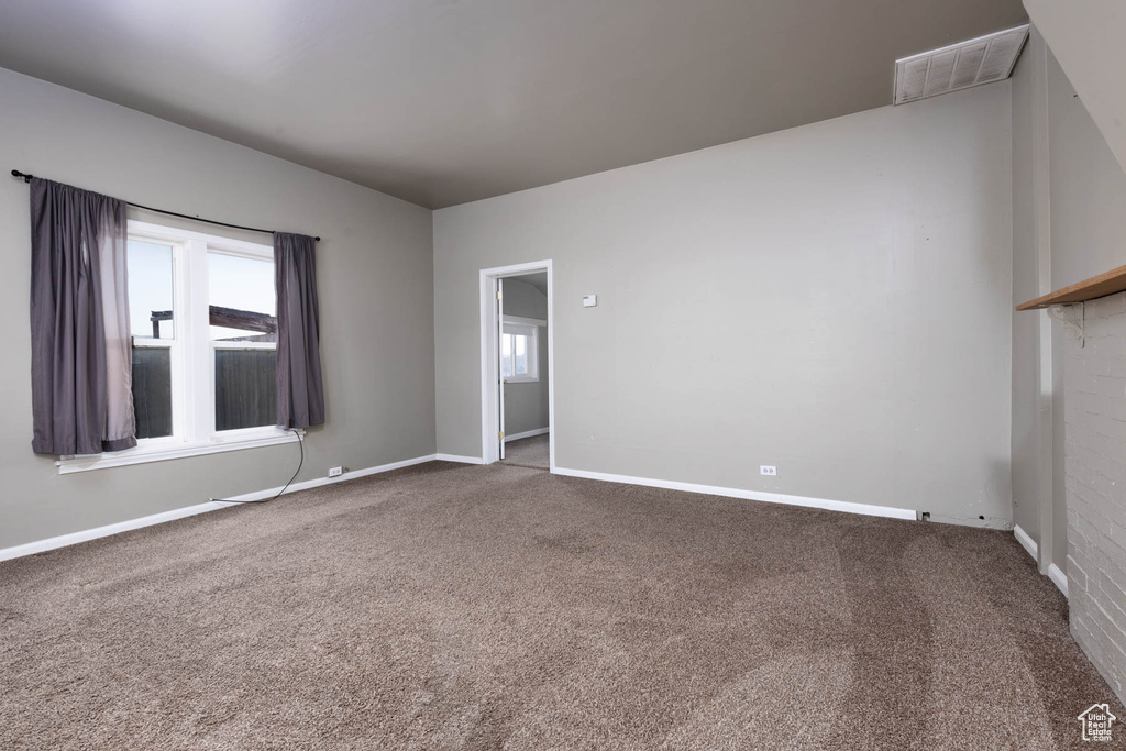 Spare room featuring carpet flooring and healthy amount of natural light
