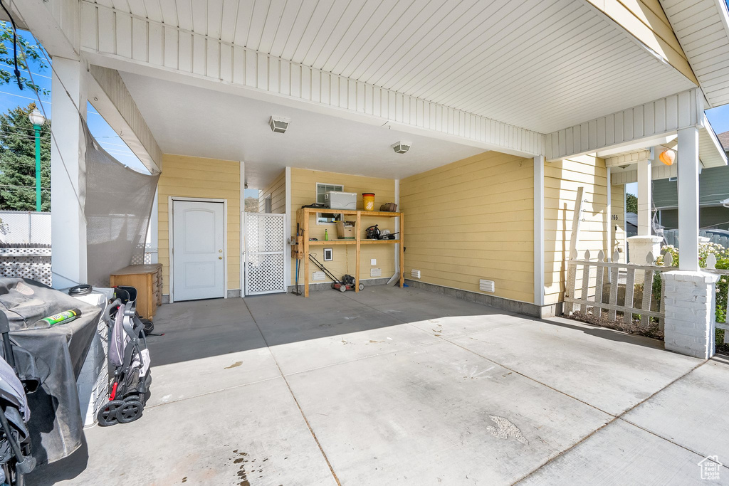 View of patio / terrace with a carport