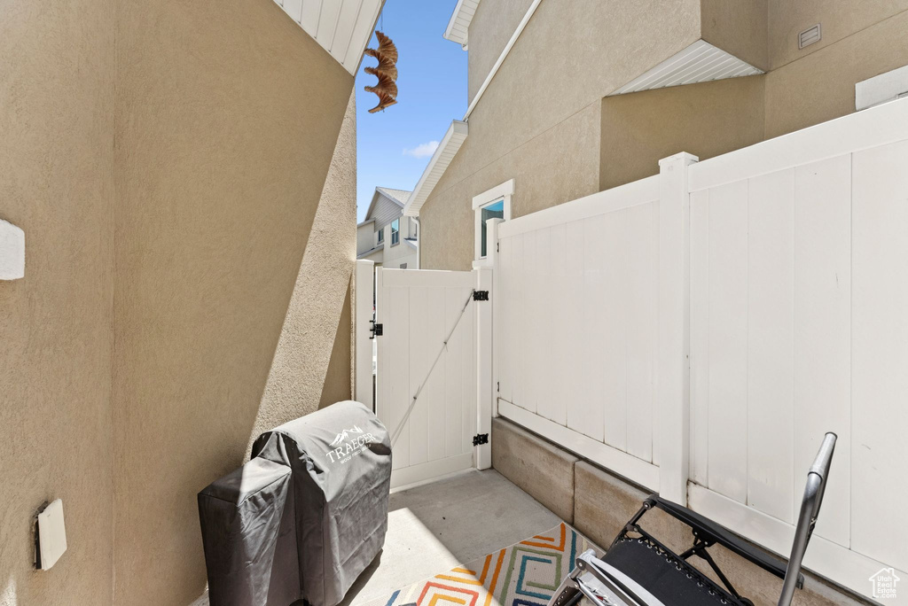 View of patio / terrace featuring a gate and a grill