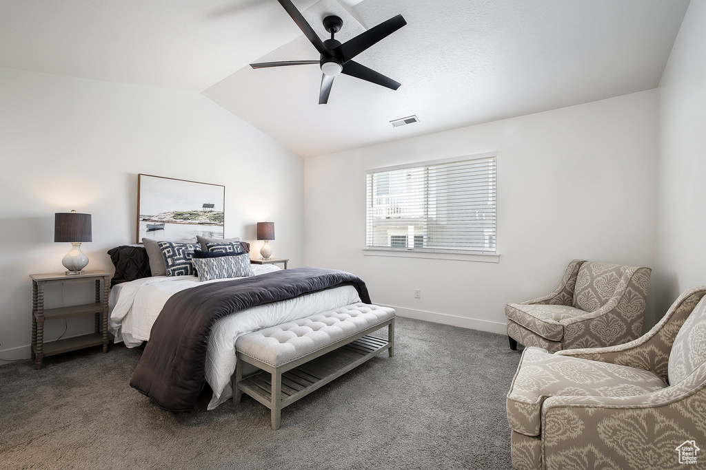 Bedroom featuring carpet, vaulted ceiling, and ceiling fan