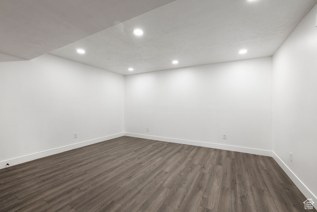 Spare room featuring recessed lighting and dark wood finished floors