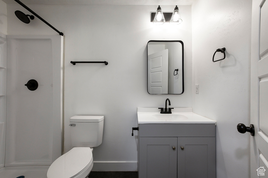Full bathroom featuring a shower and vanity