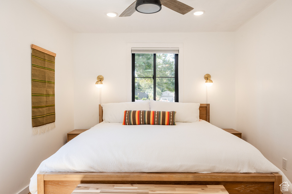 Bedroom with a ceiling fan and recessed lighting