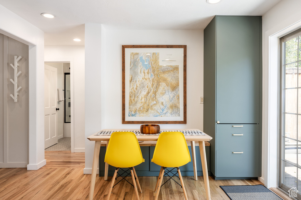 Dining room featuring light wood finished floors and recessed lighting
