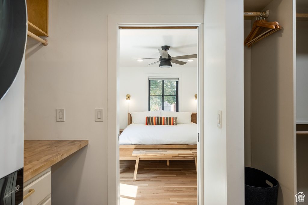 Bedroom with light wood finished floors and recessed lighting