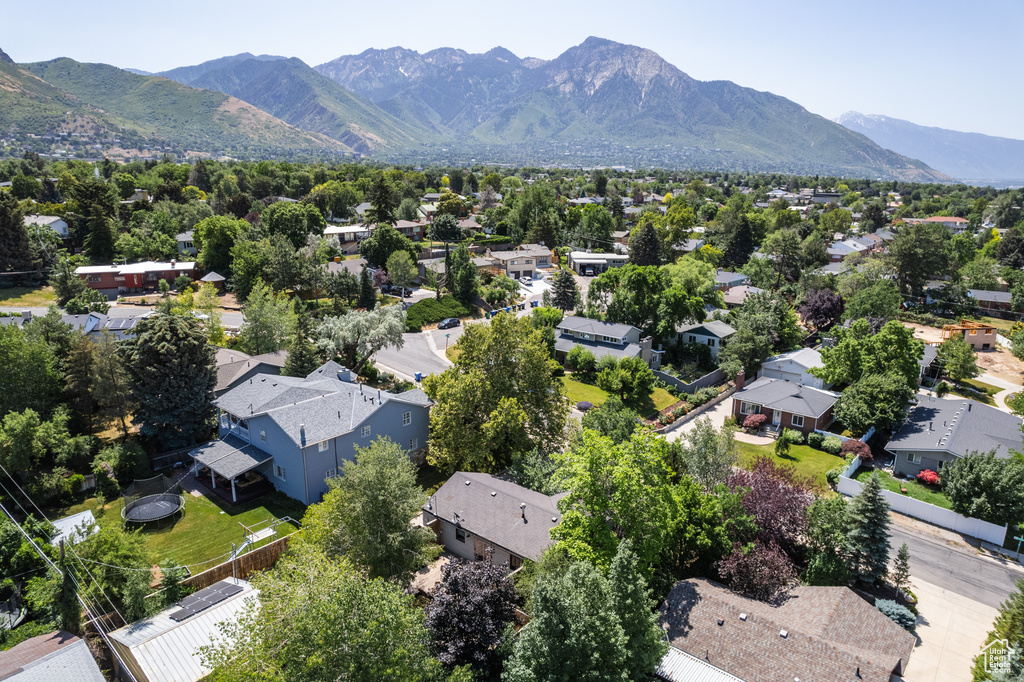 Aerial perspective of suburban area featuring a mountainous background