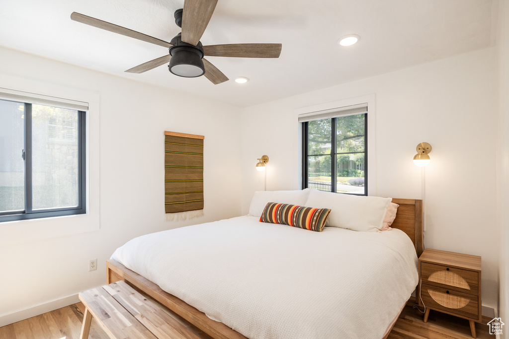 Bedroom with wood finished floors, recessed lighting, and ceiling fan