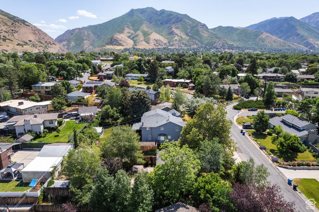Aerial view of residential area featuring mountains