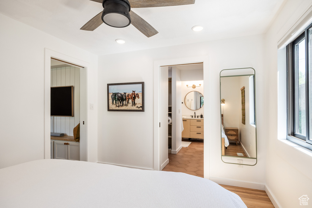 Bedroom featuring recessed lighting, a ceiling fan, and ensuite bath