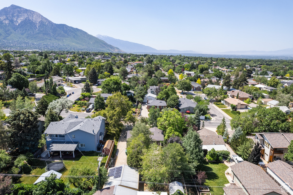 Aerial perspective of suburban area with a mountainous background