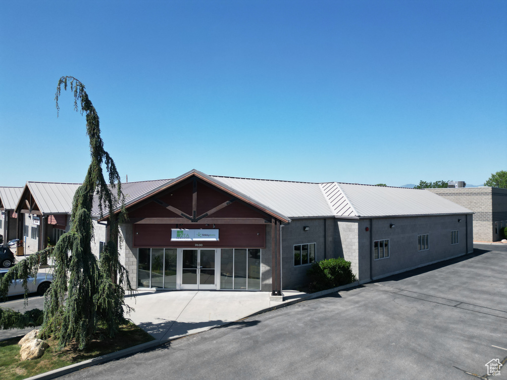 View of front facade with a metal roof