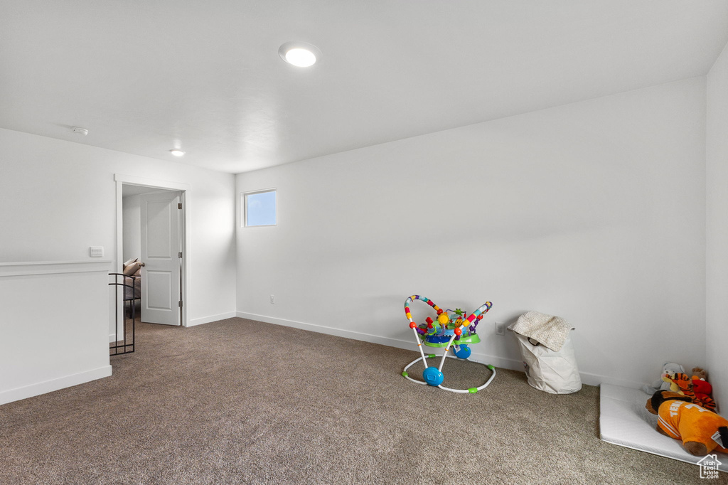 Rec room with carpet floors and baseboards