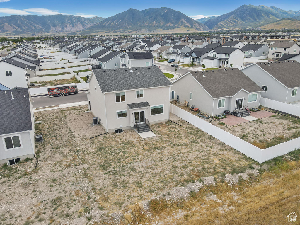 Aerial view of residential area with a mountainous background