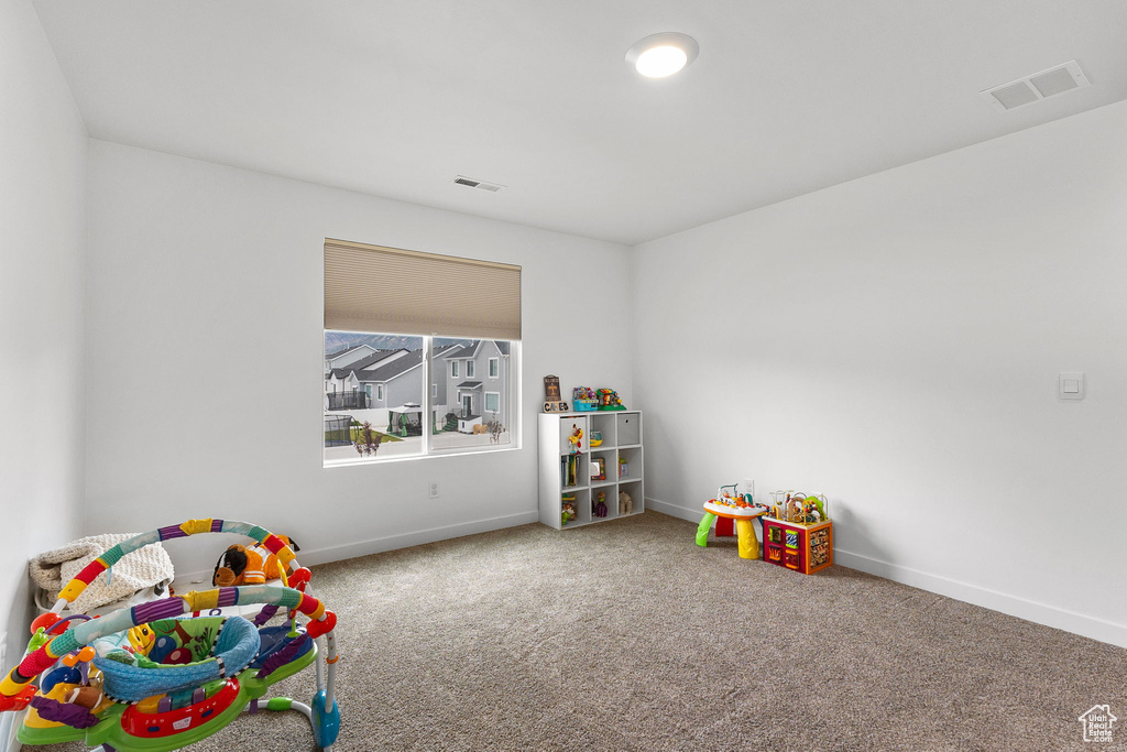 Game room with carpet floors and baseboards