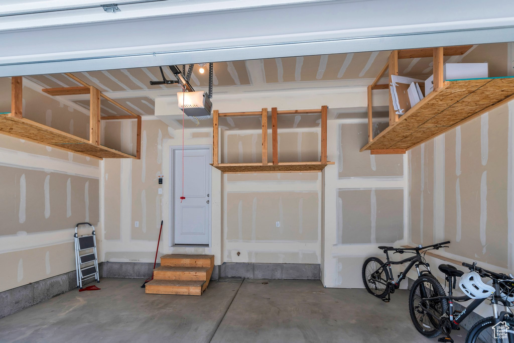 Garage featuring a garage door opener