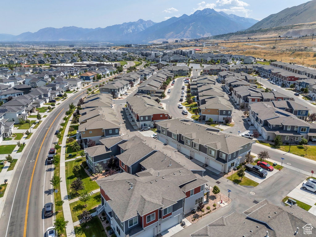 Aerial view of residential area featuring a mountain backdrop