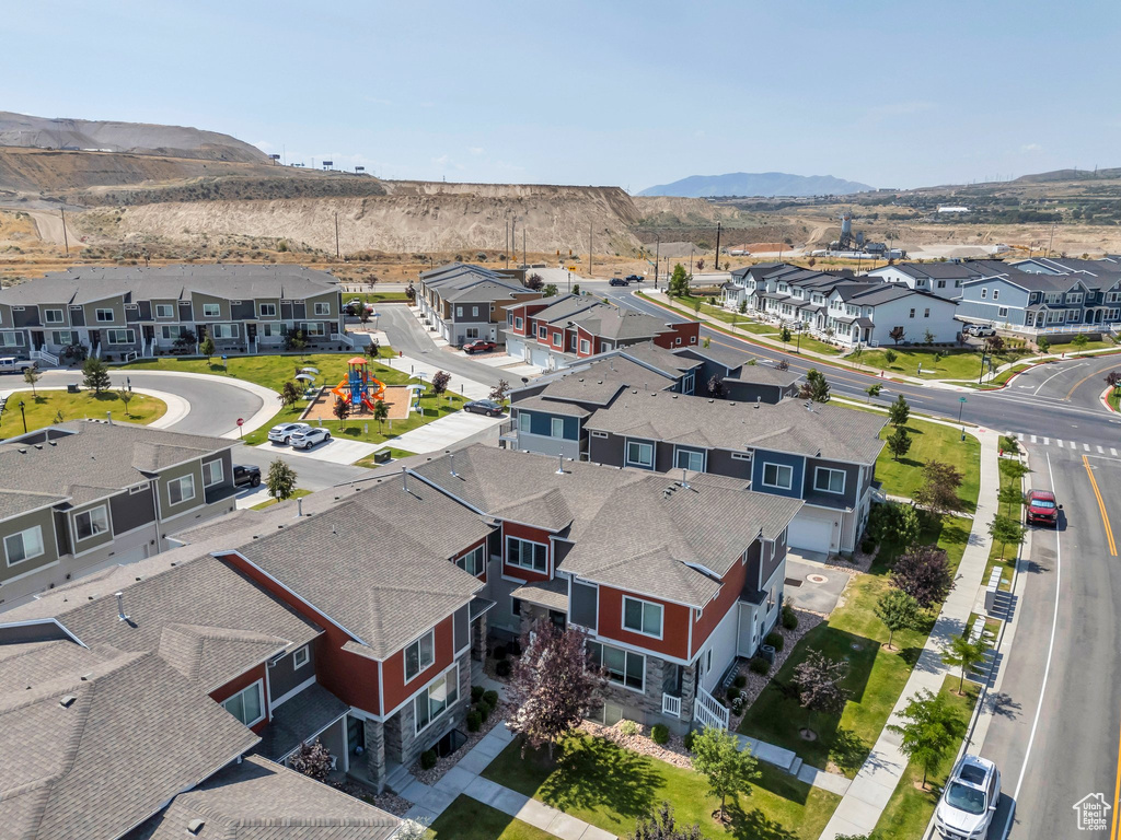 Aerial perspective of suburban area featuring a mountainous background