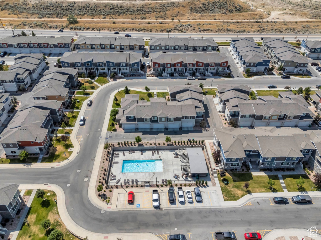 Aerial perspective of suburban area featuring a pool