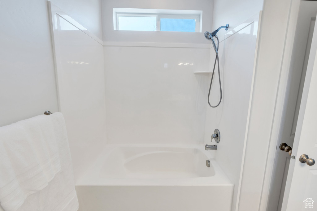 Full bath featuring shower / washtub combination
