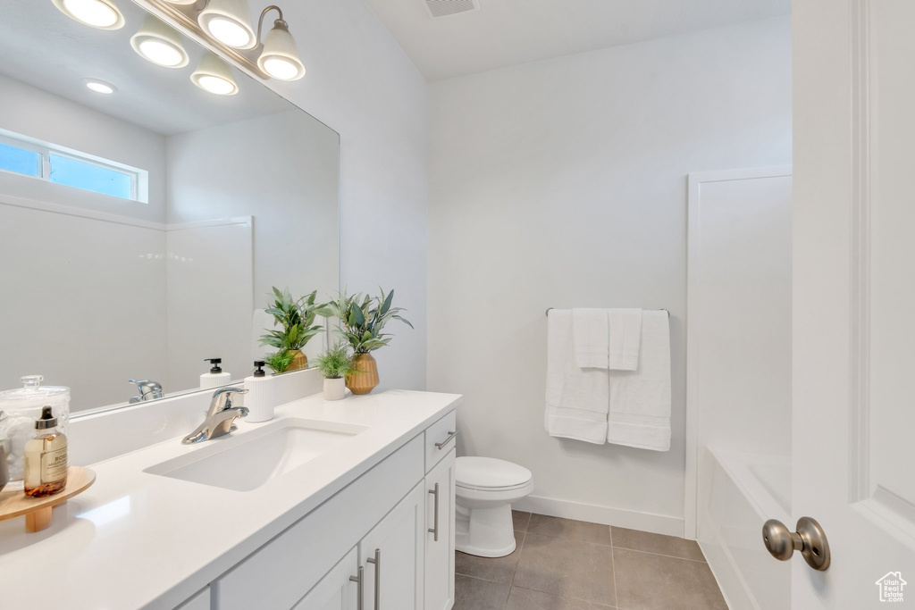 Bathroom featuring vanity and tile patterned floors