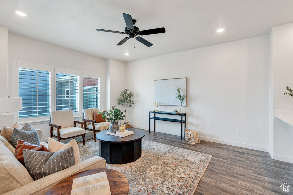 Living room with wood finished floors, ceiling fan, and recessed lighting