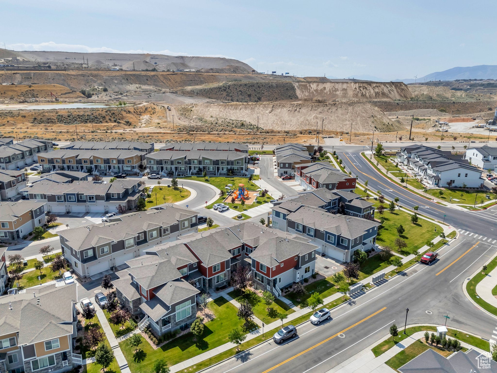Aerial perspective of suburban area with a mountain backdrop