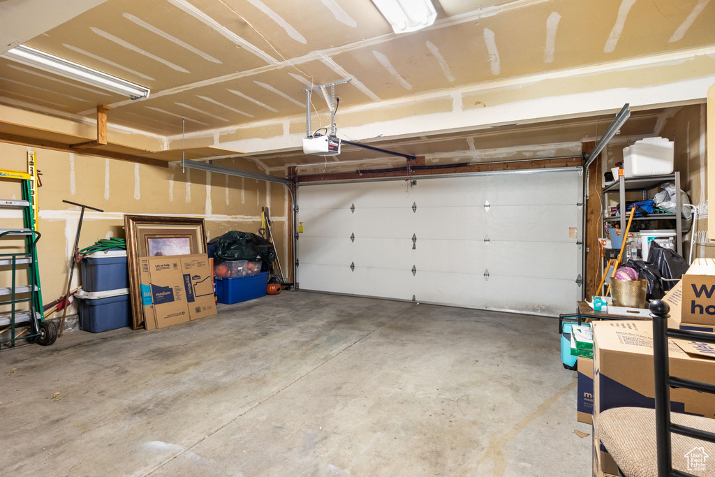 Garage featuring a garage door opener