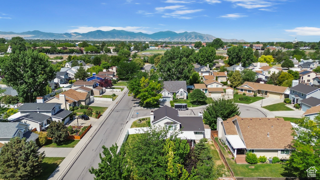 Aerial view of residential area featuring a mountainous background