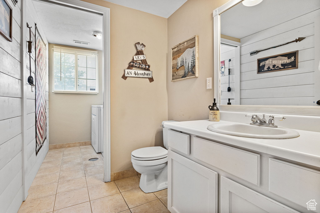 Full bath featuring vanity, tile patterned flooring, and a shower with curtain