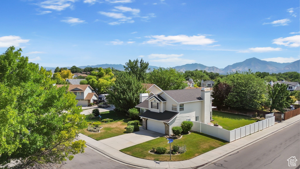 View of subject property featuring a mountain backdrop