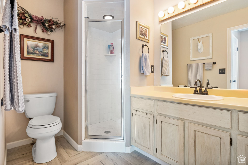 Bathroom with vanity and a stall shower