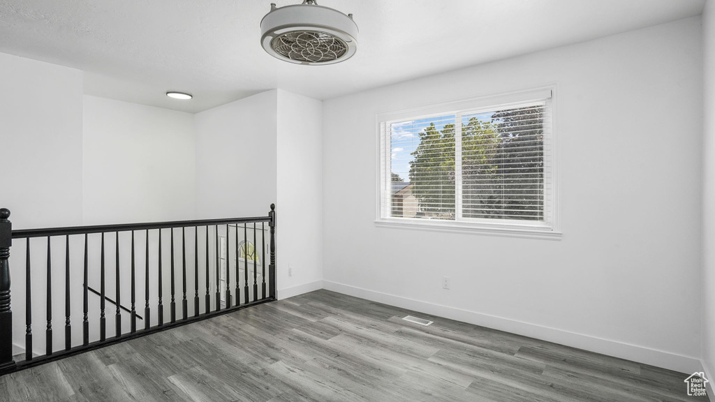 Spare room with wood finished floors