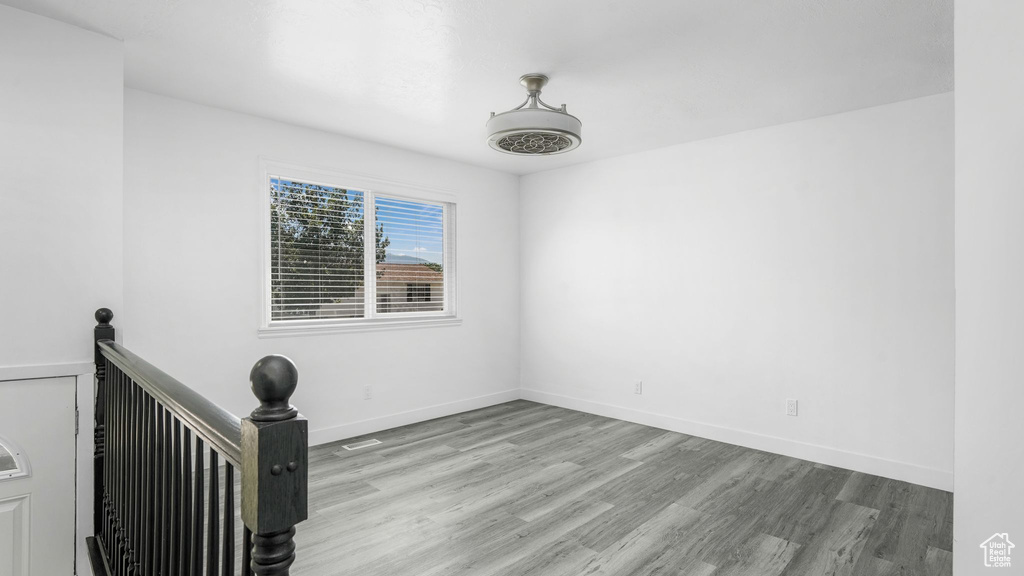 Empty room with wood finished floors and baseboards