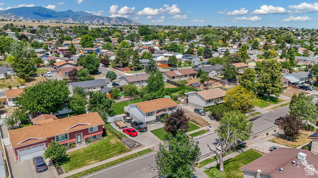 Aerial view of residential area featuring a mountain backdrop
