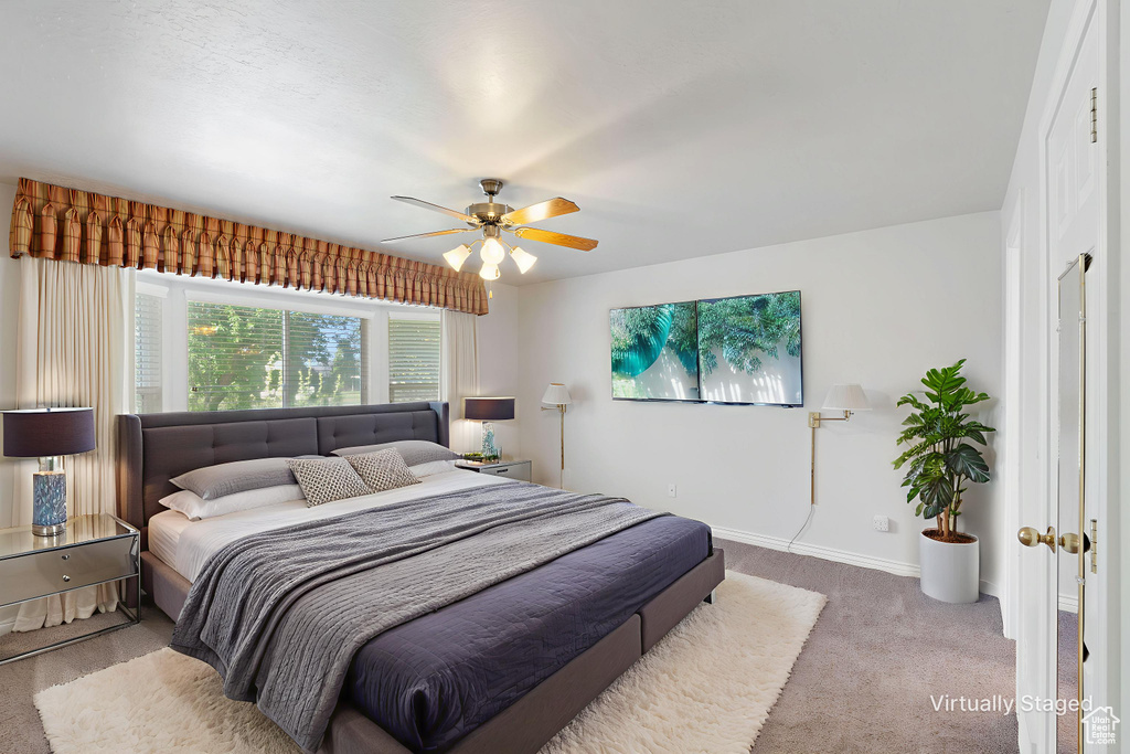 Bedroom with carpet flooring and ceiling fan