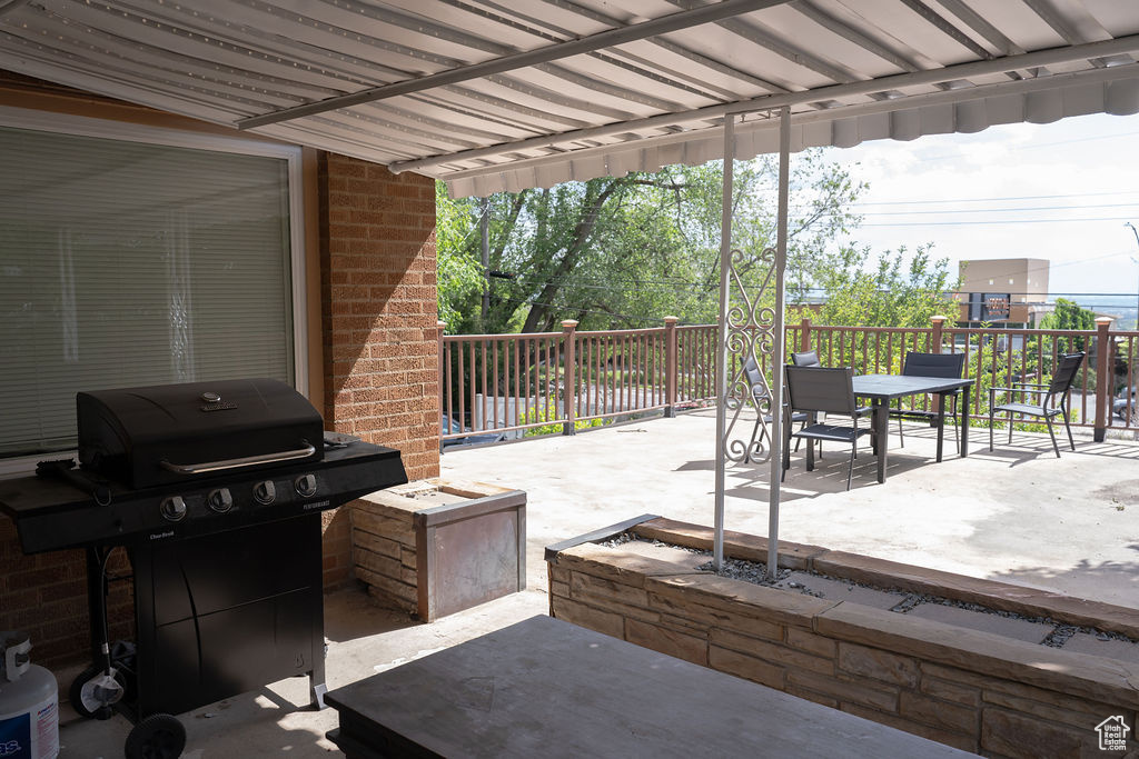 View of patio / terrace featuring a grill and outdoor dining area