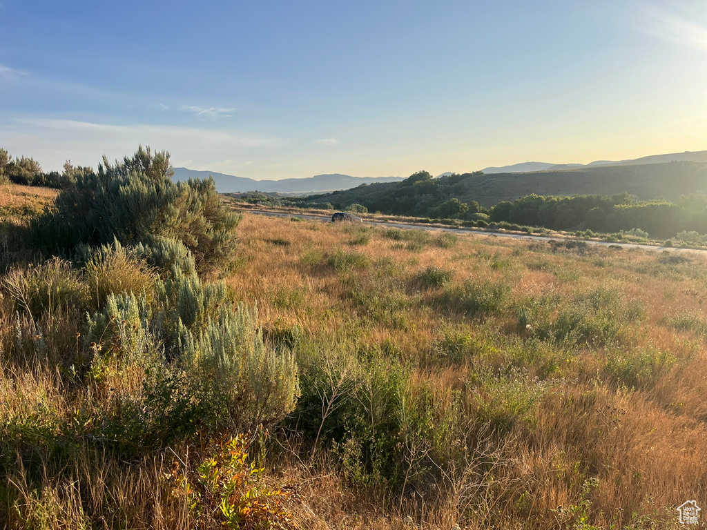 View of mountain backdrop with rural landscape