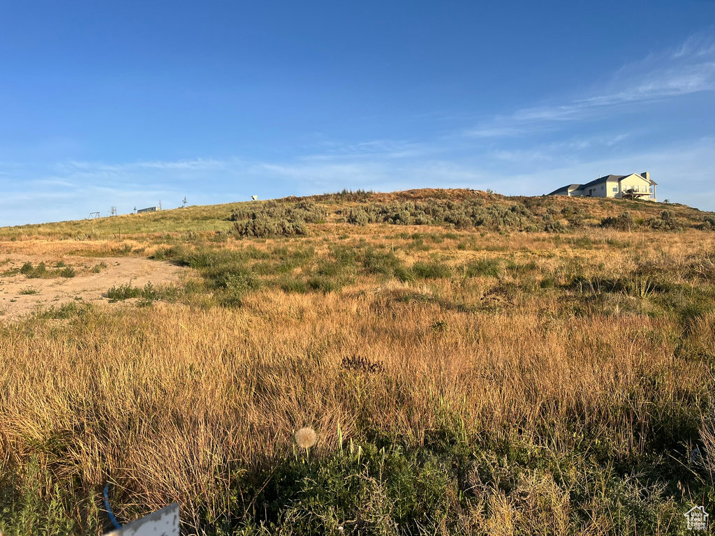 View of mountain backdrop featuring rural landscape