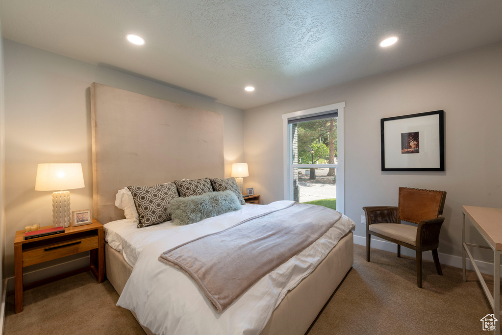 Carpeted bedroom featuring recessed lighting