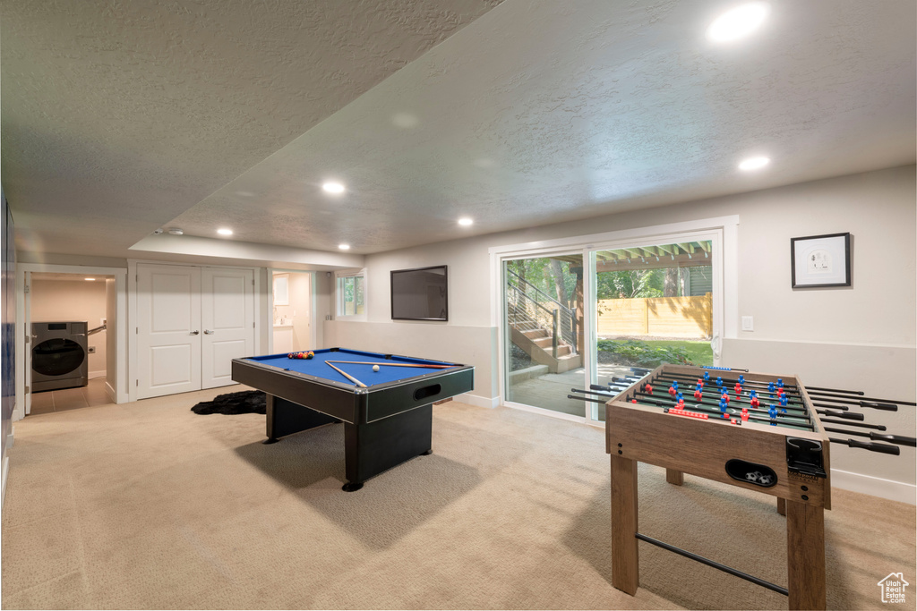 Recreation room with washer / dryer, recessed lighting, pool table, light colored carpet, and a textured ceiling