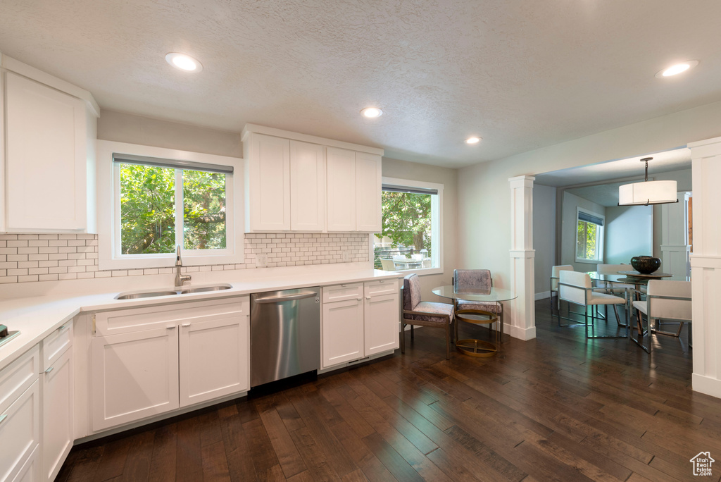 Kitchen featuring dishwasher, white cabinetry, backsplash, recessed lighting, and a textured ceiling