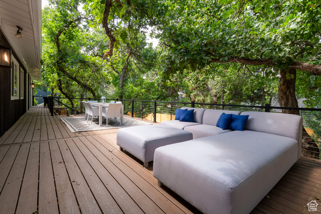 Wooden terrace with outdoor dining area and an outdoor hangout area