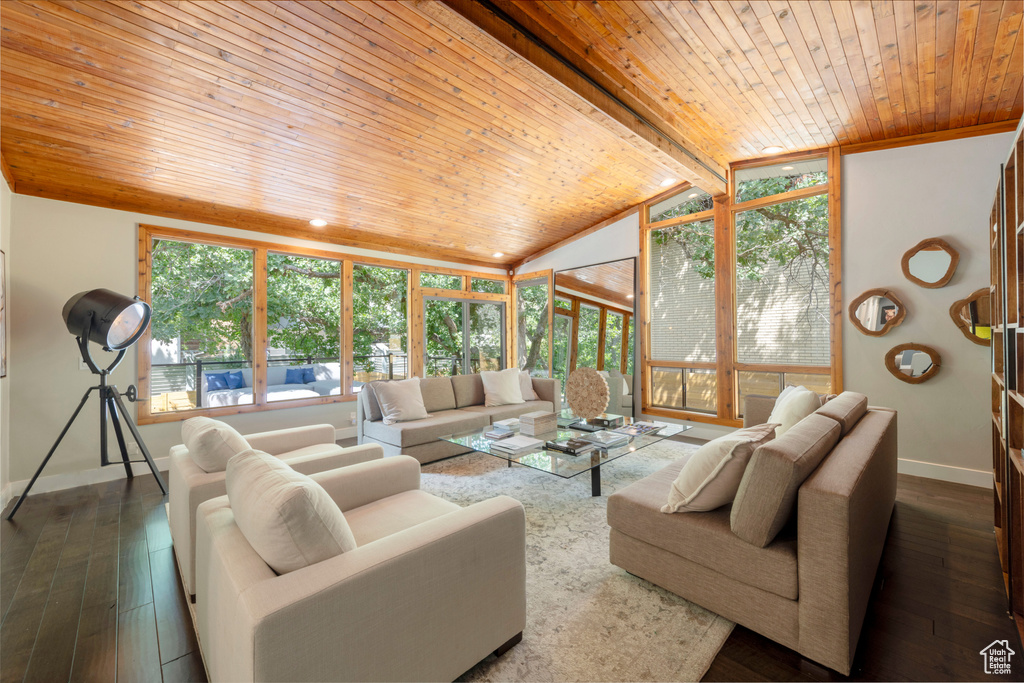 Living area featuring wood ceiling and dark wood-style floors