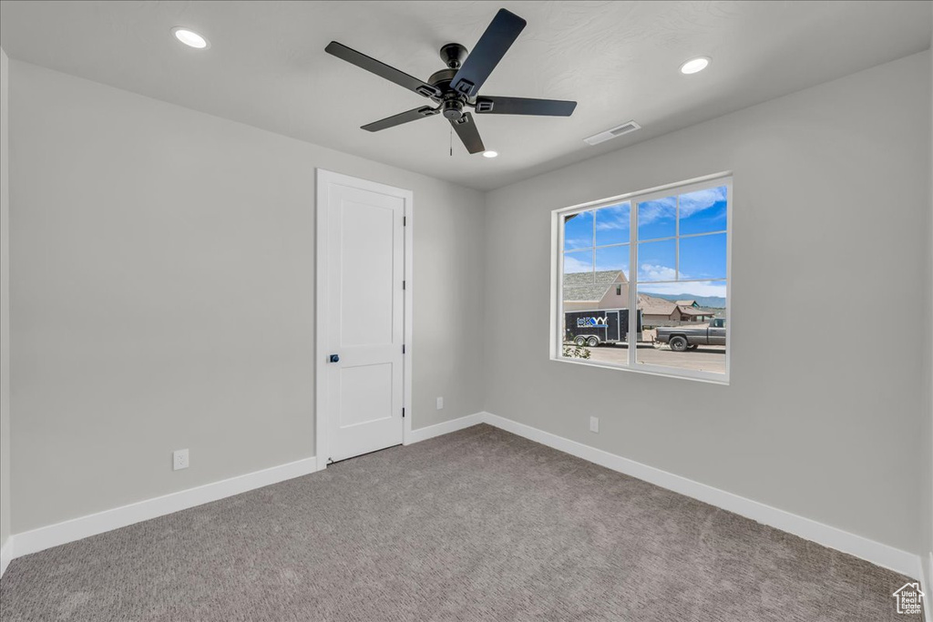 Carpeted spare room with recessed lighting and ceiling fan
