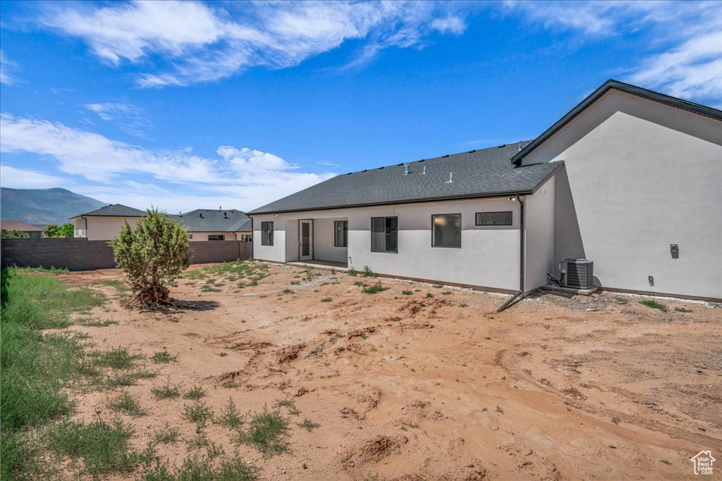 Rear view of property featuring stucco siding
